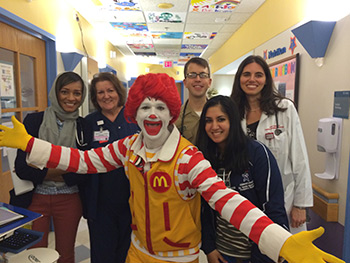 residents pose with Ronald McDonald